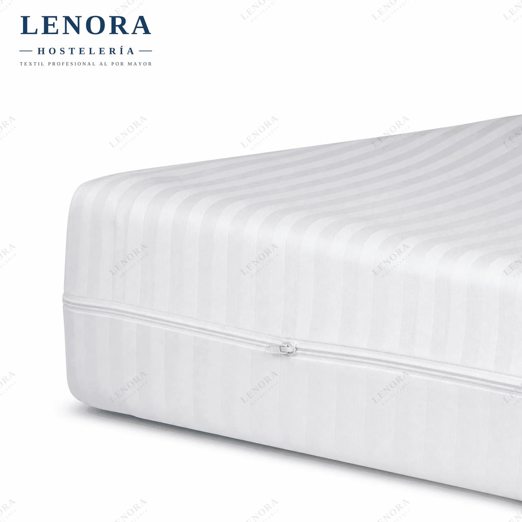 Funda de colchón de cutí blanca con cremallera cubriendo el colchón