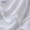 Tejido voile blanco semitransparente drapeado