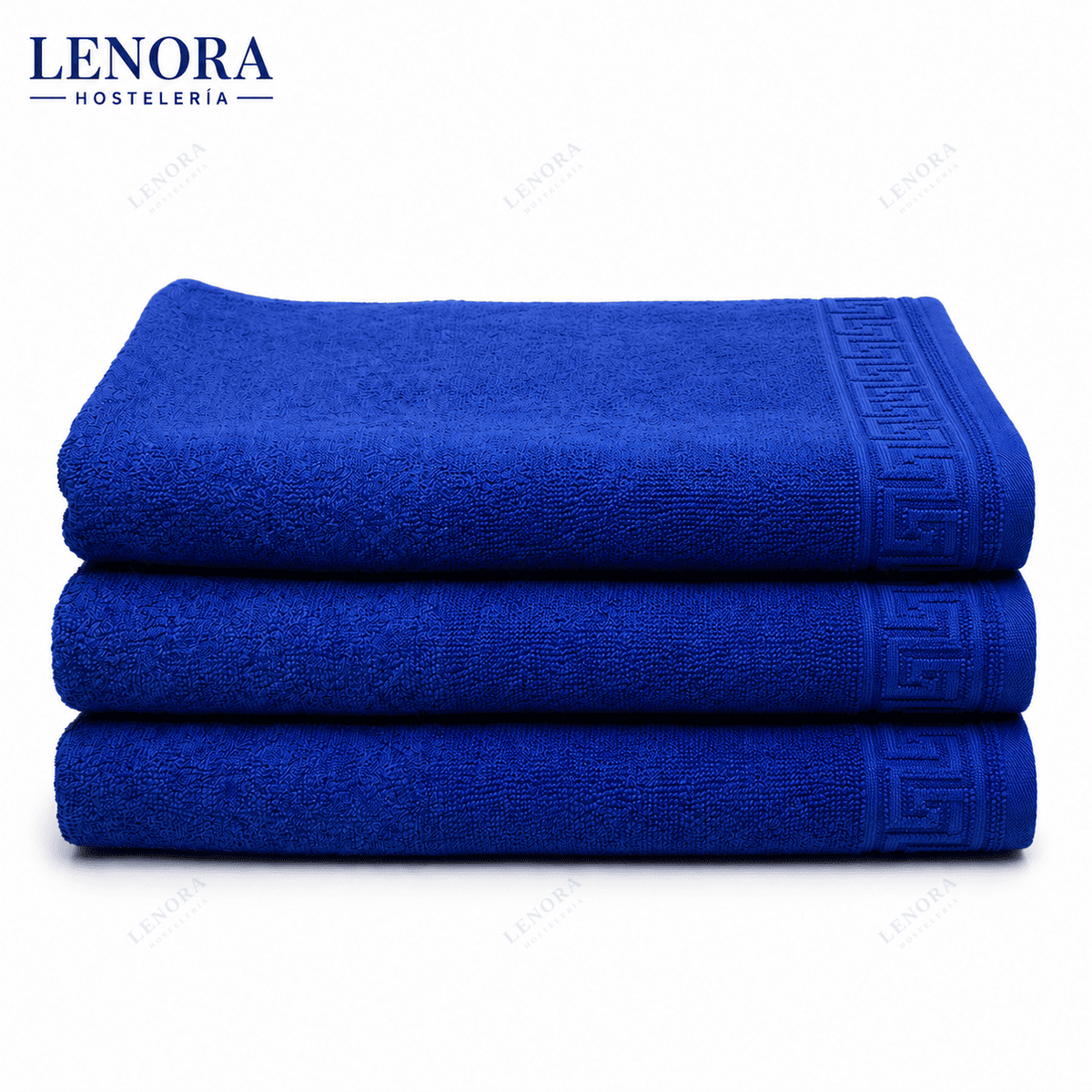 Alfombrines de baño azul Idanthren apilados con cenefa de greca