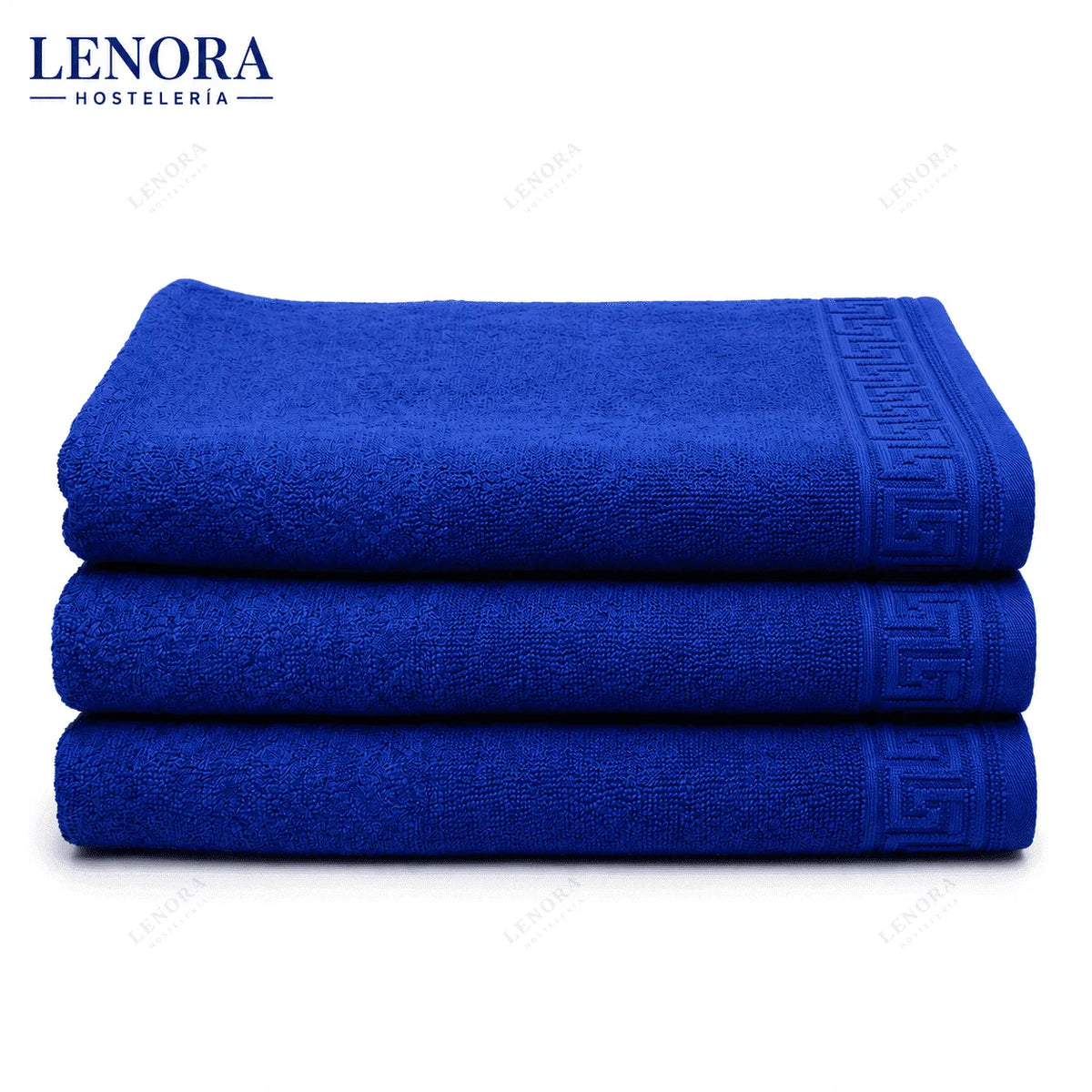 Alfombrines de baño azul Idanthren apilados con cenefa de greca
